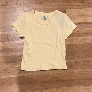 Brandy Melville pale yellow baby tee